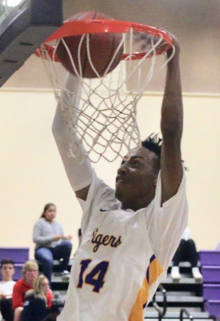 Jayden Jones comes up with a slam dunk Friday night in the LHS Event Center as the Tigers defeated Hanford 66-58.